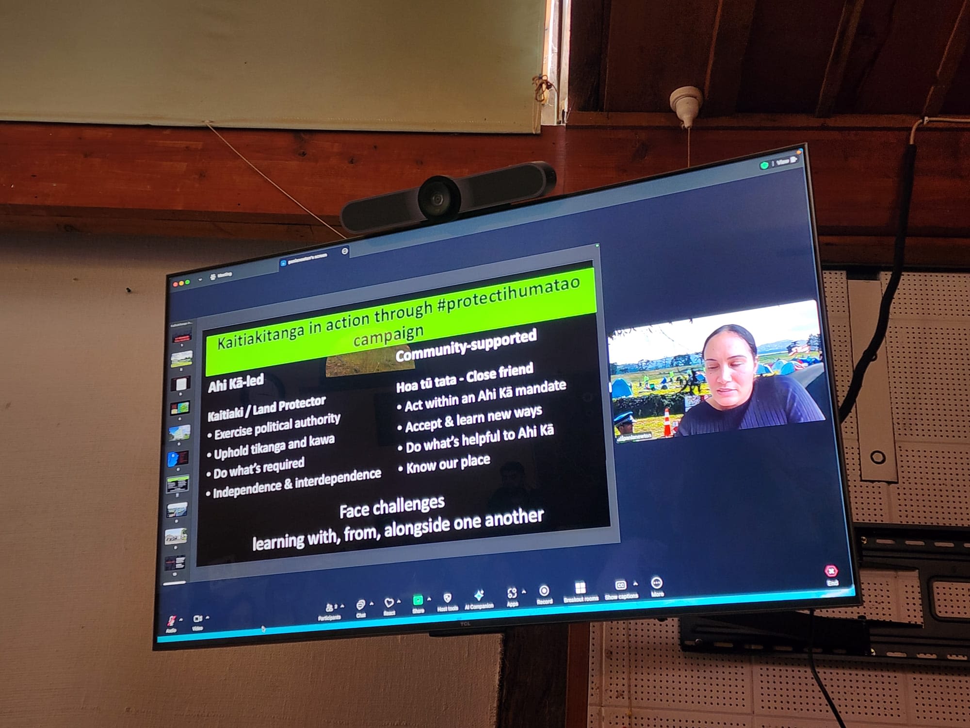 A photo of a webinar being played on the TV. 